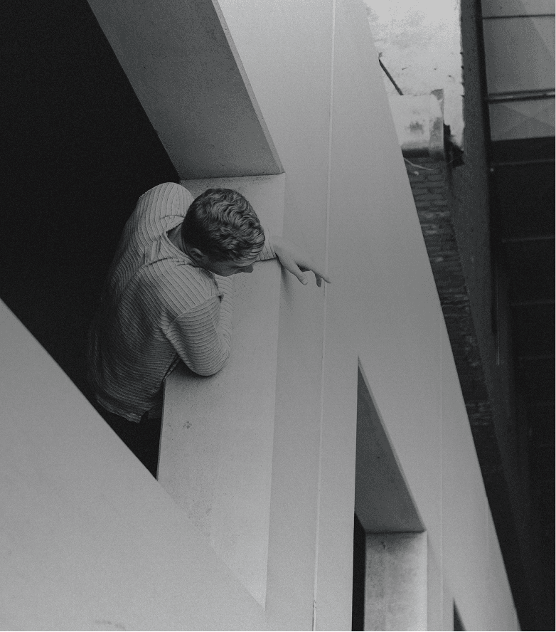 Man looking out a window